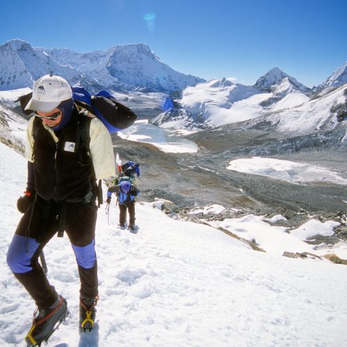 Amputee and Everest Sumitter Gary Guller hikes up a ridge out of a glacial valley in the Himalayan range.
